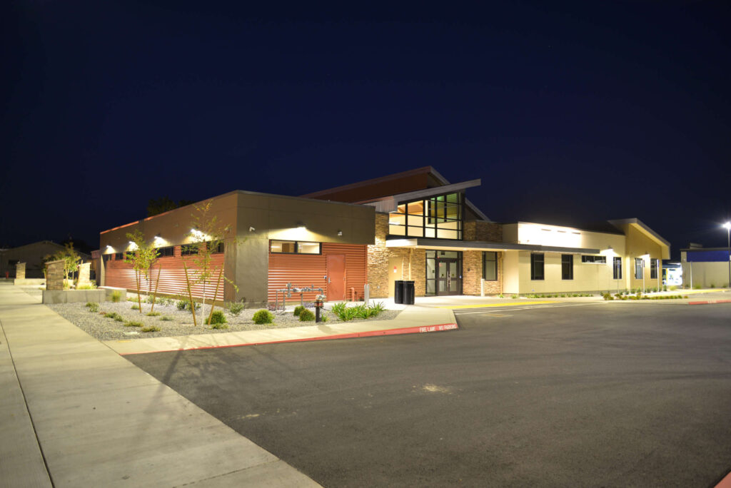 Nighttime outdoor view of the Anderson Family Health & Dental Center at the Shasta Community Health Center