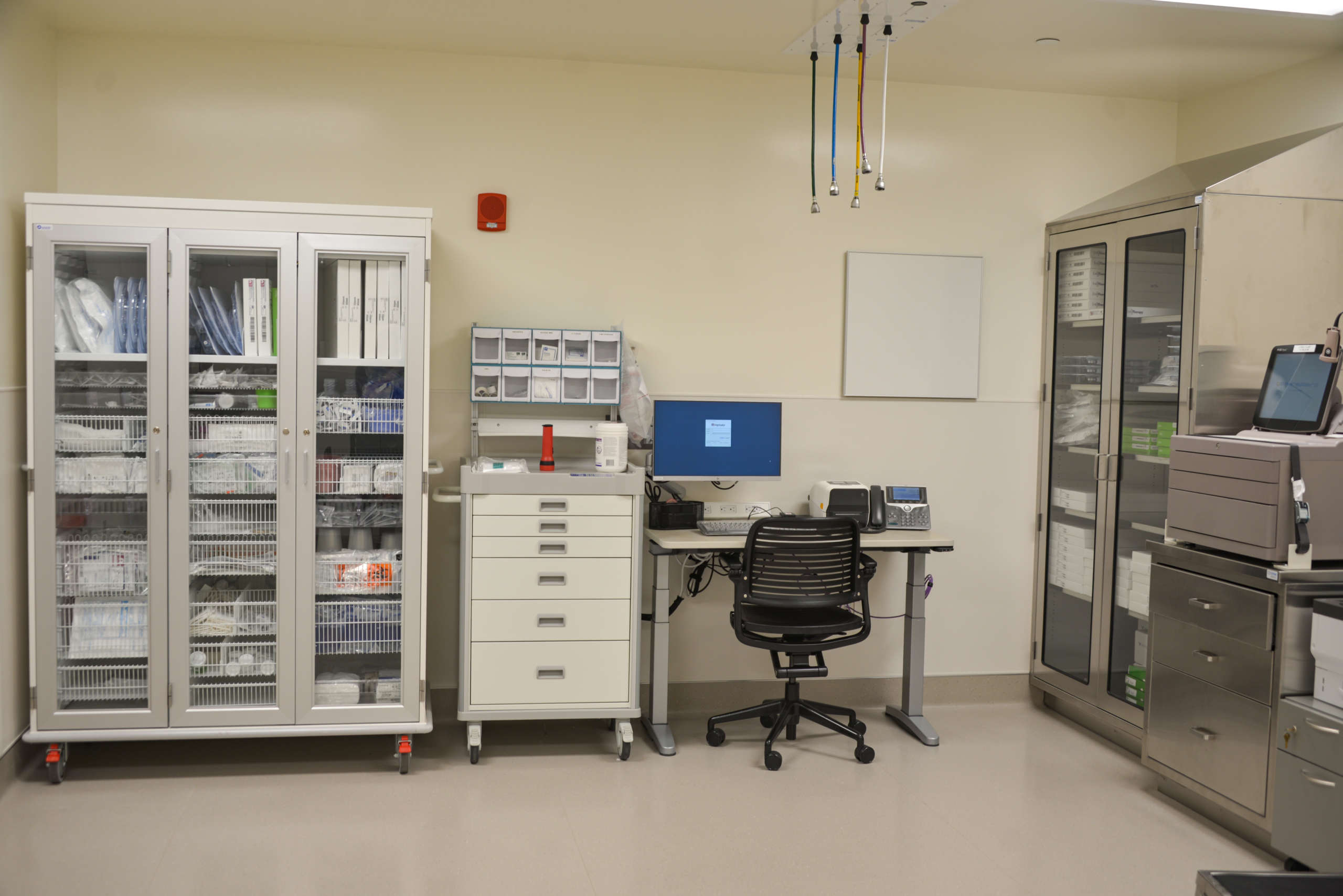 Medical equipment installed and stored in a room with a desk at the UC Davis Health Pulmonary & GI Remodel